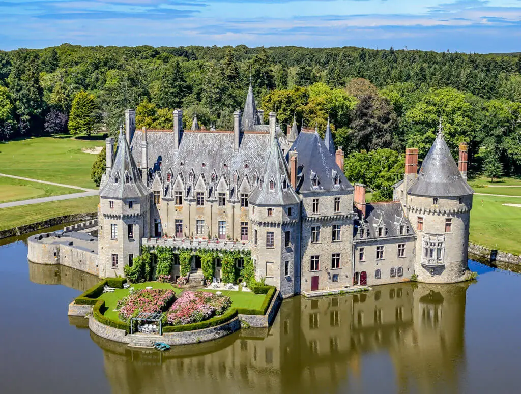 Picturesque view of Château de la Bretesche and its lake